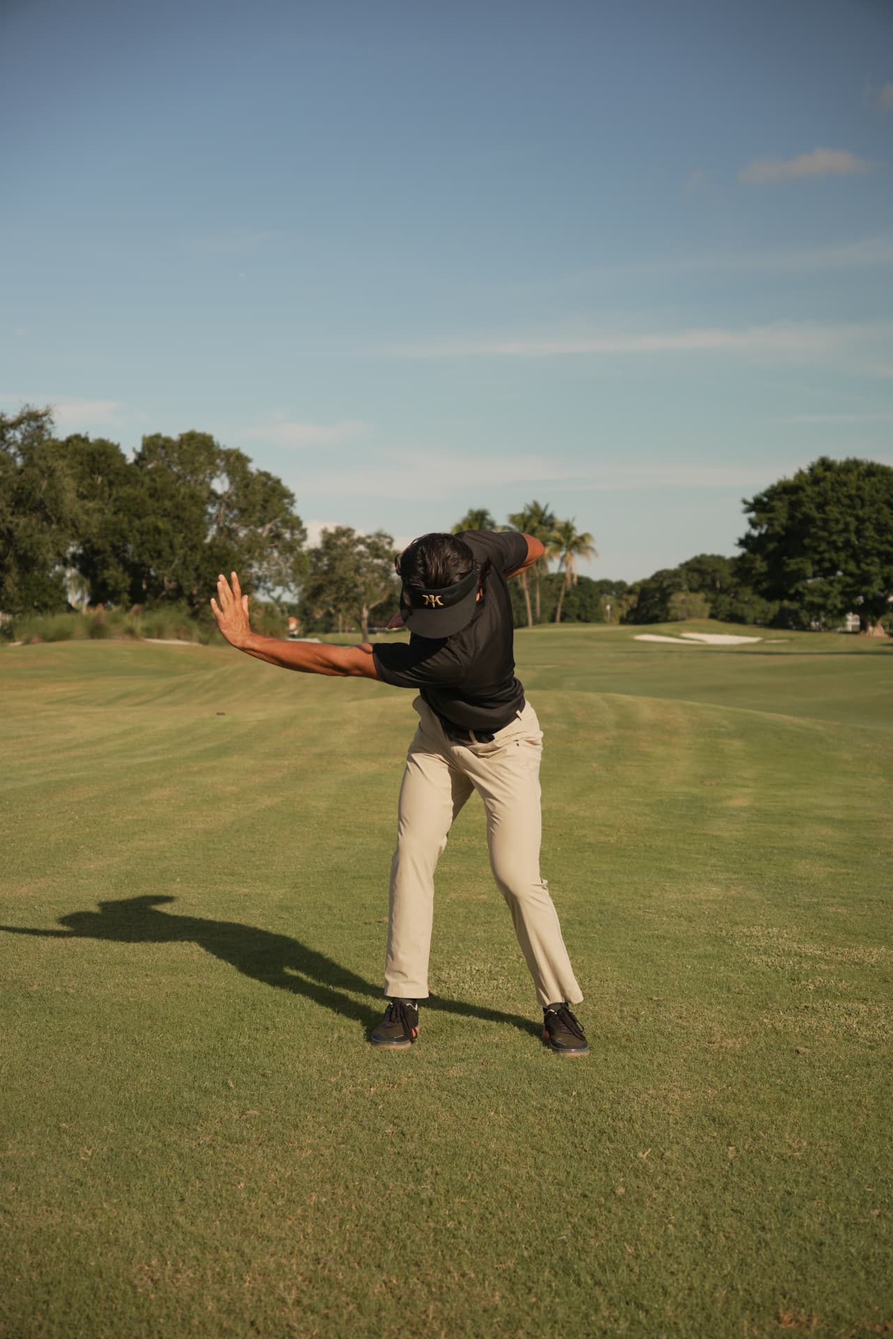 Leo Herrera mid-movement on the golf course